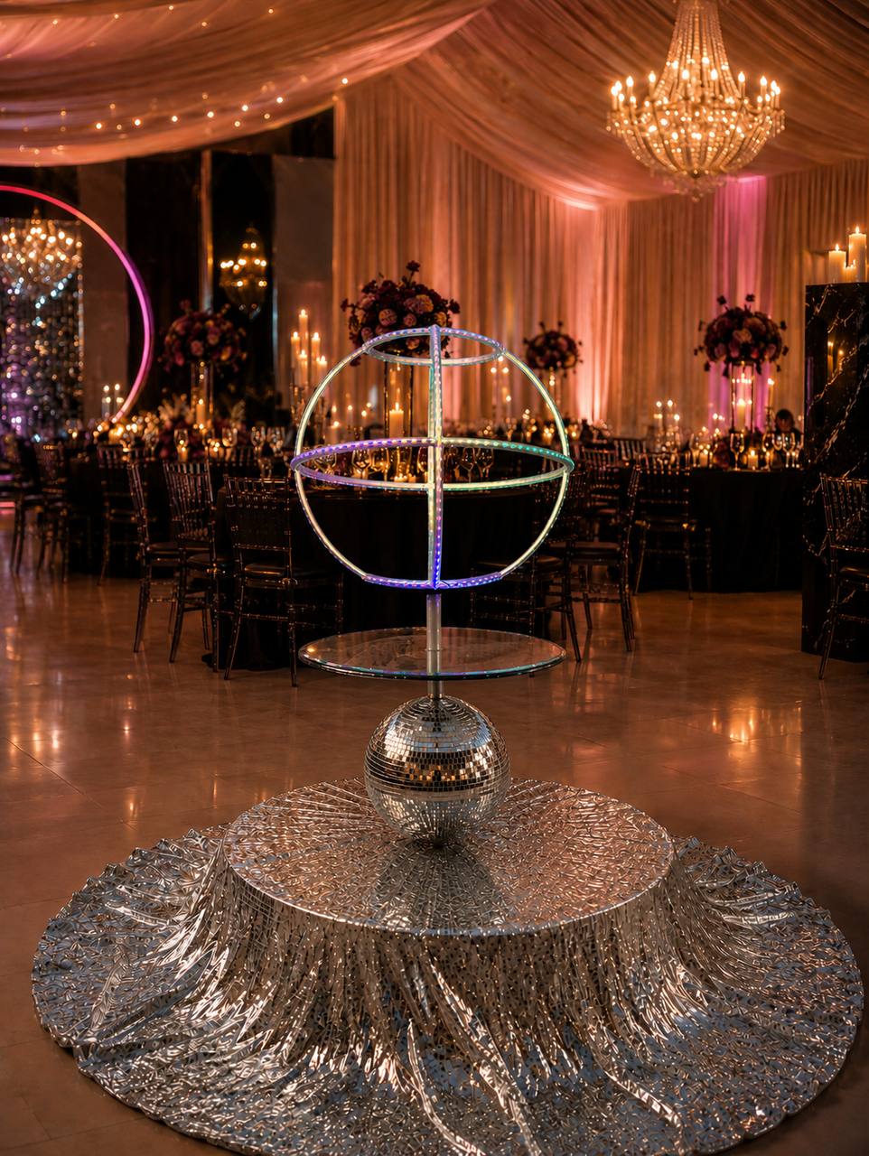 Disco Luxe Platform with a glowing LED sphere prop at an evening Las Vegas reception