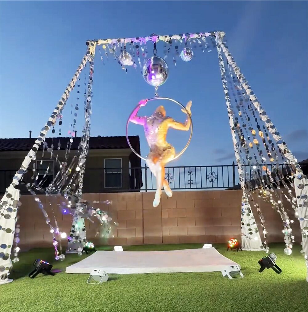 Leap under the mirror-garland disco rig