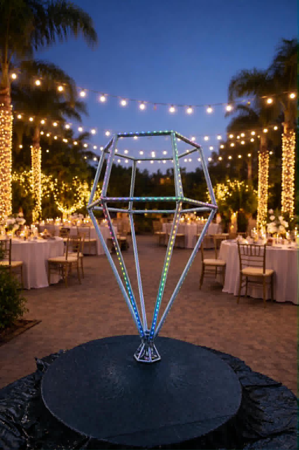 LED diamond glowing beside evening dinner tables