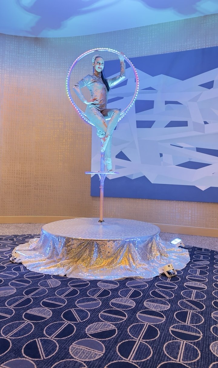 LED Lollipop aerial prop with performer in glowing ring